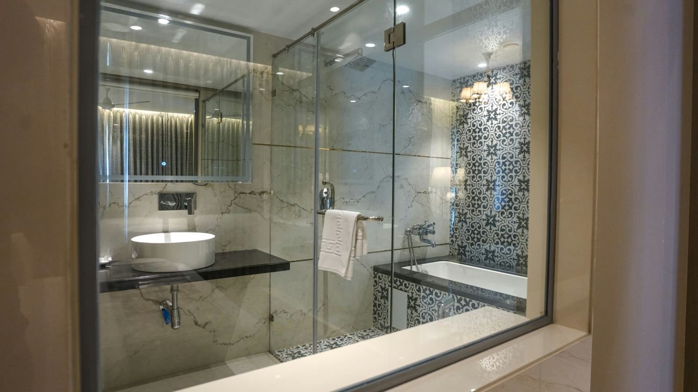 A modern bathroom features a shower and sink.